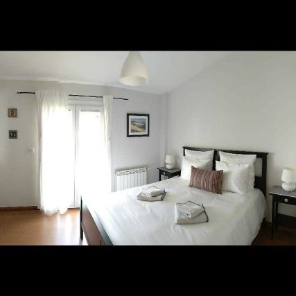 1st floor room with double bed, bathroom and small balcony facing the south; at the frontside of the house.